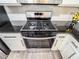 Close-up of a stainless steel gas range at 3150 Stratford Green Pl, Avondale Estates, GA 30002