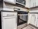 Kitchen view featuring gas range, black countertops and stainless steel appliances at 3150 Stratford Green Pl, Avondale Estates, GA 30002