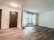 Bright living room featuring wood floors, a large window, and freshly painted walls at 3150 Stratford Green Pl, Avondale Estates, GA 30002