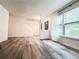 Inviting living room with hardwood floors and a large window for natural light at 3150 Stratford Green Pl, Avondale Estates, GA 30002