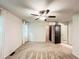 Spacious bedroom featuring carpet floors, ceiling fan, windows, and a walk-in closet at 3150 Stratford Green Pl, Avondale Estates, GA 30002