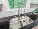 Stainless steel double sink features a window view and modern faucet at 3150 Stratford Green Pl, Avondale Estates, GA 30002