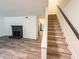 Carpeted staircase leading to the upper level, complemented by a fireplace at 3150 Stratford Green Pl, Avondale Estates, GA 30002