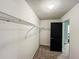 Spacious walk-in closet offers ample storage with wire shelving and neutral carpeting at 3150 Stratford Green Pl, Avondale Estates, GA 30002