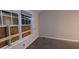 A bedroom with carpeted floors, a window with blinds, and freshly painted walls at 3778 Glen Mora Dr, Decatur, GA 30032