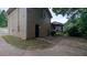 The back of the house has siding, an entrance, a screened in back porch, and a sidewalk at 3778 Glen Mora Dr, Decatur, GA 30032