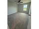 Bedroom with ceiling fan, neutral walls, neutral carpet, and a single window providing natural light at 4266 Mulberry Pass Ct, Hoschton, GA 30548