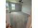 Bedroom featuring neutral walls, neutral carpet, a ceiling fan and a single window providing natural light at 4266 Mulberry Pass Ct, Hoschton, GA 30548