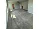 Spacious bonus room with neutral walls, neutral carpet, and multiple windows for natural light at 4266 Mulberry Pass Ct, Hoschton, GA 30548