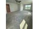 Spacious bonus room featuring carpet, neutral walls, ceiling fan, and windows that provide natural light at 4266 Mulberry Pass Ct, Hoschton, GA 30548