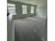 Bonus room with neutral walls, neutral carpet, and multiple windows that provide natural light at 4266 Mulberry Pass Ct, Hoschton, GA 30548