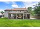 Sprawling backyard featuring patio with outdoor kitchen, living area, and a relaxing hammock at 4903 Wilkie Nw Way, Acworth, GA 30102