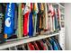 Walk-in closet featuring custom shelving and hanging storage for clothes at 4903 Wilkie Nw Way, Acworth, GA 30102