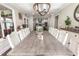 Inviting dining room boasting natural light, a long wood table, and a view into the kitchen at 4903 Wilkie Nw Way, Acworth, GA 30102