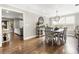 Elegant dining room with hardwood floors, a modern chandelier, and plenty of natural light at 4903 Wilkie Nw Way, Acworth, GA 30102