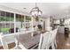 Spacious dining room featuring a large window, hardwood floors, and a view to the backyard at 4903 Wilkie Nw Way, Acworth, GA 30102