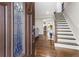 Welcoming foyer featuring hardwood floors, a staircase, and a view into the open floor plan at 4903 Wilkie Nw Way, Acworth, GA 30102
