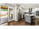 Bright eat-in kitchen with stainless steel appliances and a view of the outside entertainment area at 4903 Wilkie Nw Way, Acworth, GA 30102