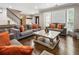 Bright and airy living room with stylish furniture, hardwood floors, and large windows at 4903 Wilkie Nw Way, Acworth, GA 30102