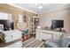 Functional home office featuring wood-paneled walls, built-in shelves, and a comfortable workspace at 4903 Wilkie Nw Way, Acworth, GA 30102