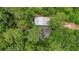 Aerial view of a small building surrounded by dense trees at 750 Old Loganville Road Southwest, Loganville, GA 30052