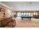 Finished basement featuring a bar, pool table, and comfortable seating area, ideal for entertaining guests at 750 Old Loganville Road Southwest, Loganville, GA 30052