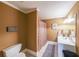 Functional bathroom with a double sink vanity, toilet, and a shower with a patterned curtain at 750 Old Loganville Road Southwest, Loganville, GA 30052