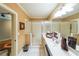 Bathroom with glass shower, double sinks and white cabinets at 750 Old Loganville Road Southwest, Loganville, GA 30052