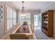 Dining room with natural lighting, shuttered windows and wooden furnishings at 750 Old Loganville Road Southwest, Loganville, GA 30052