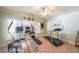 Home gym featuring various exercise machines and a ceiling fan at 750 Old Loganville Road Southwest, Loganville, GA 30052