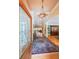 Elegant foyer with hardwood floors, a decorative rug, and a view of the living spaces beyond the leaded glass front door at 750 Old Loganville Road Southwest, Loganville, GA 30052