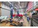 A spacious garage contains a car lift and a red truck for the ultimate car enthusiast at 750 Old Loganville Road Southwest, Loganville, GA 30052