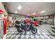 Spacious garage with checkered floor, classic cars, and vintage decor, perfect for the car enthusiast at 750 Old Loganville Road Southwest, Loganville, GA 30052