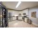 Well-lit kitchen with stainless steel appliances and white cabinetry at 750 Old Loganville Road Southwest, Loganville, GA 30052