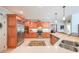 Well-equipped kitchen with stainless steel appliances and lots of wood cabinetry at 750 Old Loganville Road Southwest, Loganville, GA 30052