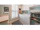 Bright laundry room features a washer, dryer, beverage cooler, and a charming 