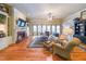 Spacious living room features hardwood floors, a fireplace, built-in shelving, and large windows at 750 Old Loganville Road Southwest, Loganville, GA 30052
