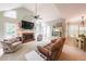 Inviting living room with a fireplace, large windows, and comfortable seating at 750 Old Loganville Road Southwest, Loganville, GA 30052