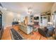 Bright living room with hardwood floors, fireplace, large windows, and comfortable seating at 750 Old Loganville Road Southwest, Loganville, GA 30052