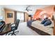 Cozy main bedroom with sitting area, ceiling fan, large windows, and a connecting room for relaxation at 750 Old Loganville Road Southwest, Loganville, GA 30052