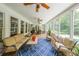 Inviting screened-in porch with comfortable seating and views of the lush backyard and pool at 750 Old Loganville Road Southwest, Loganville, GA 30052