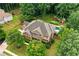 Aerial view showcases this home with professional landscaping, brick accents, and expansive driveway at 217 Heritage Town Pkwy, Canton, GA 30115