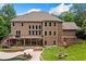 Stunning home showcasing a two-story deck, pool, landscaped yard, and fire pit perfect for outdoor gatherings at 217 Heritage Town Pkwy, Canton, GA 30115