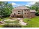 Beautiful home showcasing a spacious deck, swimming pool, fire pit, and manicured lawn ideal for outdoor living at 217 Heritage Town Pkwy, Canton, GA 30115
