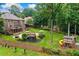 Exterior aerial view of a backyard with a pool, deck, large grassy area, and playset at 217 Heritage Town Pkwy, Canton, GA 30115