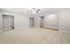 Spacious basement area featuring neutral walls, plush carpeting, and ample lighting at 217 Heritage Town Pkwy, Canton, GA 30115