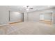 Basement area featuring neutral walls, plush carpeting, and ample lighting at 217 Heritage Town Pkwy, Canton, GA 30115