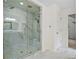 Modern bathroom featuring glass shower with marble tile and updated fixtures at 217 Heritage Town Pkwy, Canton, GA 30115