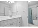 Bathroom features modern cabinetry, countertops, and a shower/tub with curtain at 217 Heritage Town Pkwy, Canton, GA 30115