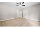 Bedroom featuring neutral walls, plush carpeting, a ceiling fan, and closet at 217 Heritage Town Pkwy, Canton, GA 30115